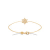 Bracelet StarLight, motif Etoile de Noël pavé d'oxydes de zirconium et monté sur chaîne forçat diamantée. Plaqué or jaune 750 millièmes.