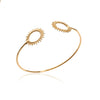Bracelet jonc double SunSet XL, composé de deux motifs soleil finition perlée, montés sur jonc fil rond. En plaqué or 750 millièmes.