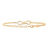 Bracelet Infinity Twist, motif infini torsadé serti d'oxydes de zirconium, monté d'un côté sur double chaîne forçat diamantée, de l'autre sur jonc fil rond. Plaqué or 750 millièmes.