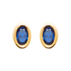 Boucles d'oreille mini, pierre ovale bleue serti clos sur plaqué or 750 millièmes, montées sur tige.