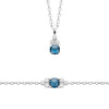Parure collier et bracelet Bleu Queen, pendentif pierre bleue et oxydes de zirconium sur chaîne forçat diamantée. En argent 925 millièmes.