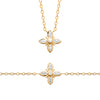 Parure collier et bracelet Flora, motif fleur serti d'oxydes de zirconium monté sur chaîne forçat diamantée. Plaqué or 750 millièmes. 