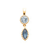 Pendentif composée de deux pierres synthétiques bleues, l'une de forme ronde, l'autre navette, serti perlé sur plaqué or 750 millièmes.